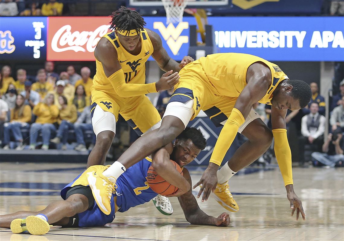 West Virginia overwhelms Pitt in 74-59 Backyard Brawl win | Pittsburgh ...