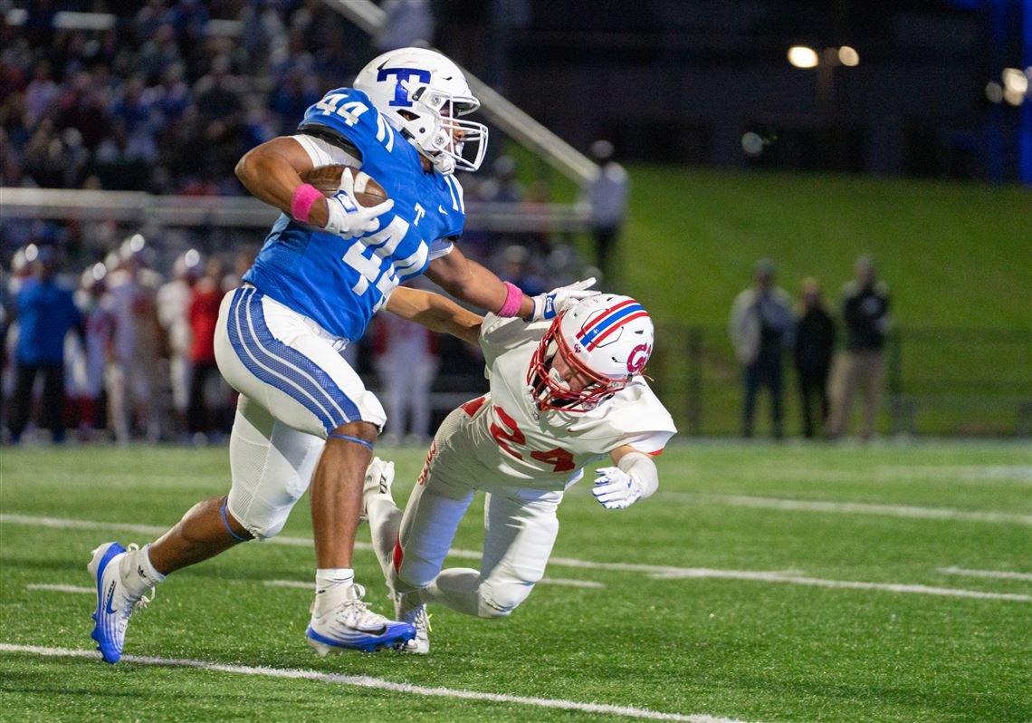 Trinity's Owen Gardner stiff arms a Chartiers Valley defender on the way for a big gain of yards, Friday, Oct. 10th, 2025, at Trinity High School.