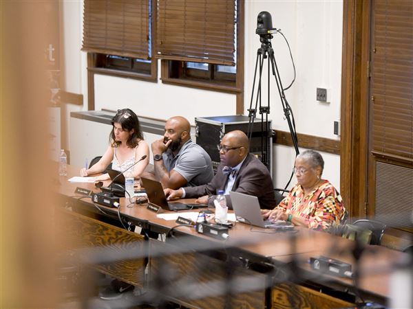 Members of the Pittsburgh Public Schools Board listen to public testimony from parents and community members concerned about the closure of Pittsburgh Montessori School during a meeting Tuesday, July 22, 2025, in Oakland. The school is one of nine up for closure.