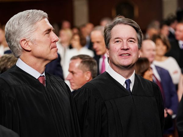Supreme Court Justices Neil Gorsuch, left, and Brett Kavanaugh attend President Donald Trump's State of the Union address, at the Capitol in Washington, Feb. 5, 2019.