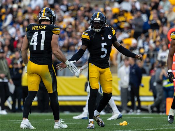 Pittsburgh Steelers linebacker Payton Wilson (41) and cornerback Jalen Ramsey (5) react during an NFL football game, Sunday, Nov. 2, 2025, in Pittsburgh.