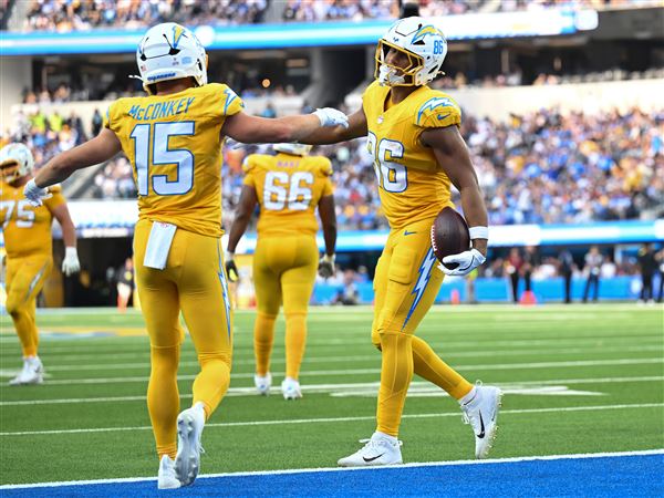 Los Angeles Chargers tight end Oronde Gadsden II (86) celebrates a touchdown with wide receiver Ladd McConkey (15) against the Indianapolis Colts during the second half of an NFL football game Sunday, Oct. 19, 2025, in Inglewood, Calif.