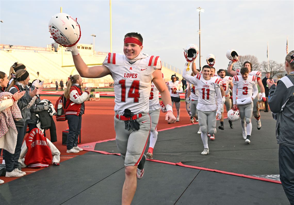 Avonworth Evan Loutzenhiser (14) runs to celebrate with family and friends after defeating Northwestern Lehigh in the PIAA Class 3A championship football game at Cumberland Valley High School in Mechanicsburg, PA on Saturday Dec. 6, 2025.