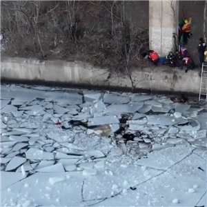Crews work at the site where a car plunged into the Monongahela River off the Parkway East.