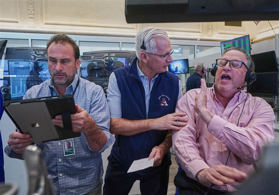 Wall Street falls from its records and oil prices jump after fighting flares in the Middle East