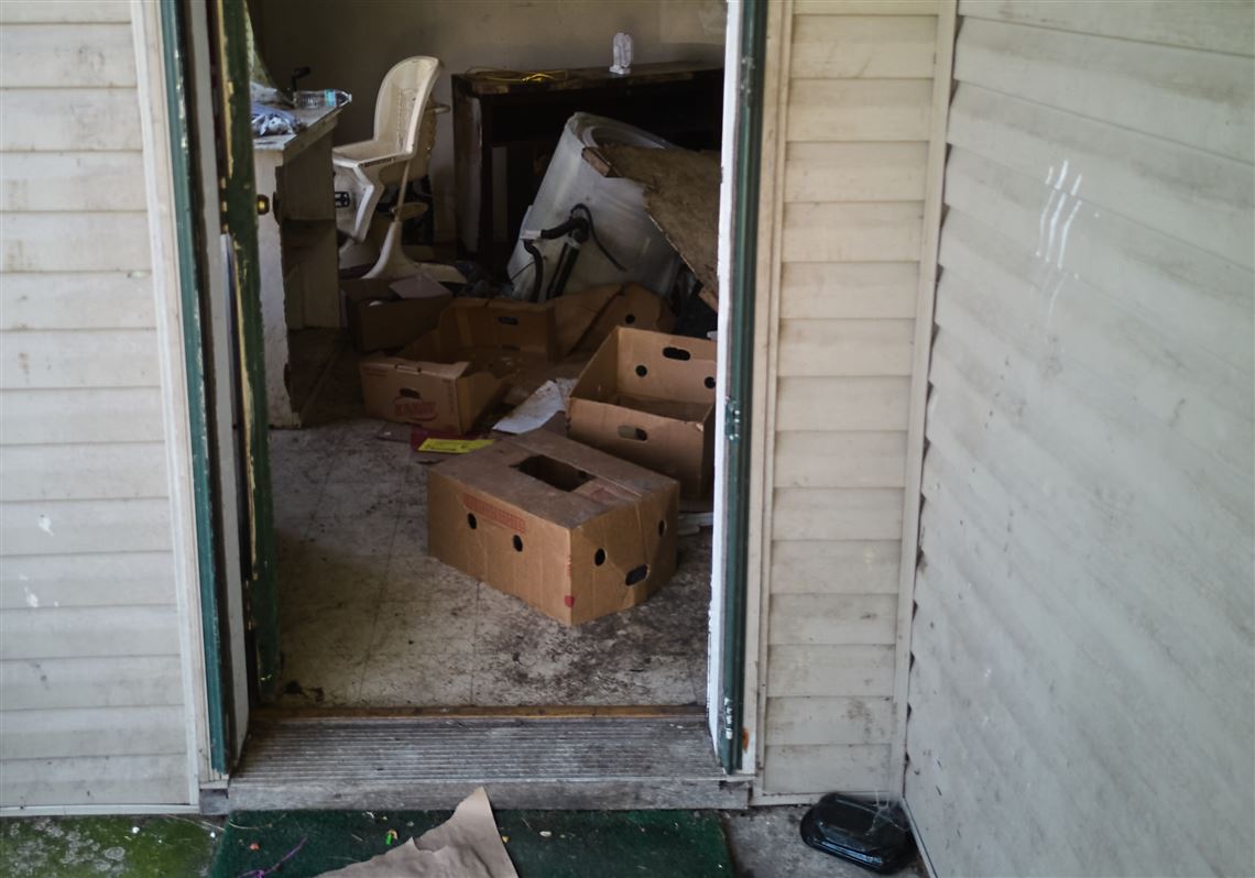 Items including a high chair are seen in a home where authorities say they removed 16 children and arrested four adults in Hamden, Ohio, on Wednesday.