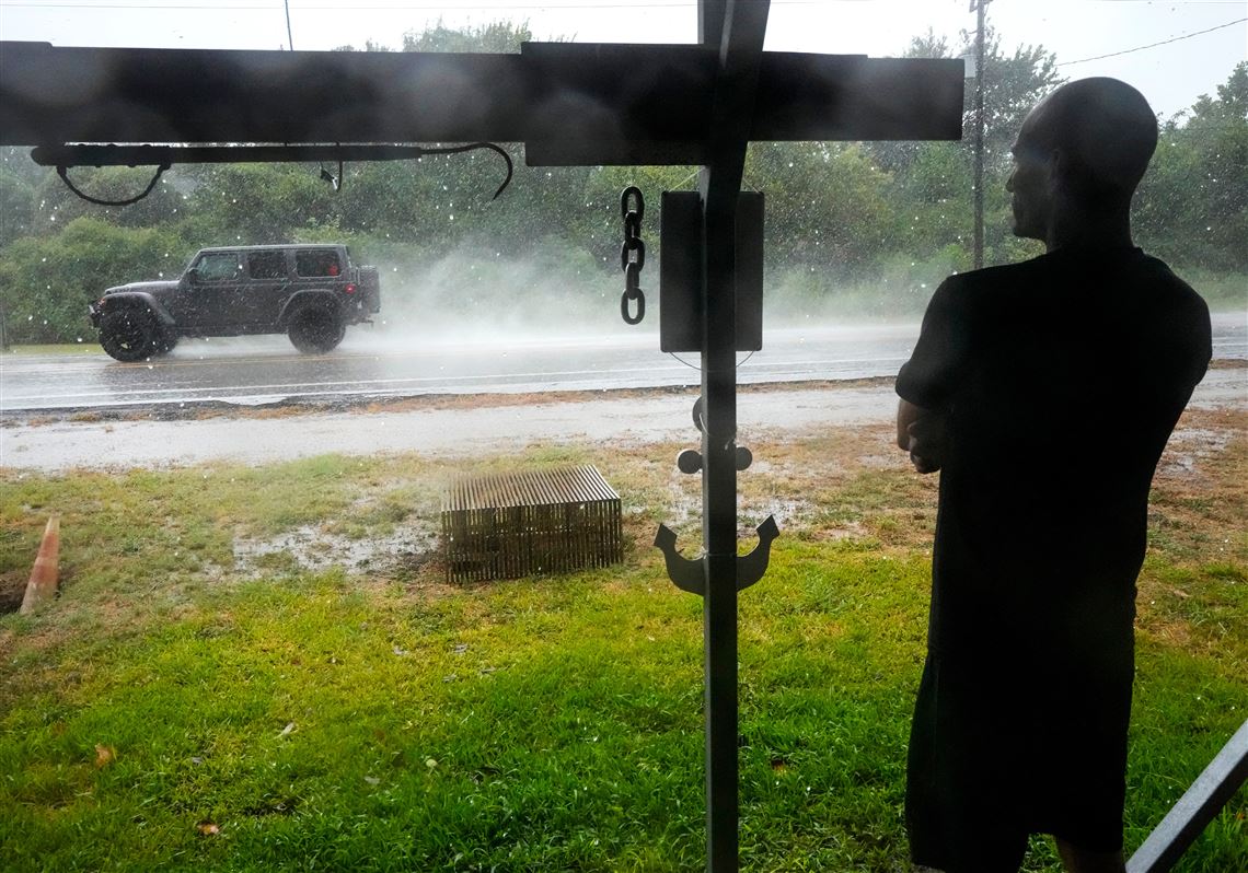 Edouard, now a tropical depression, drenches Texas with flash flooding and downed trees