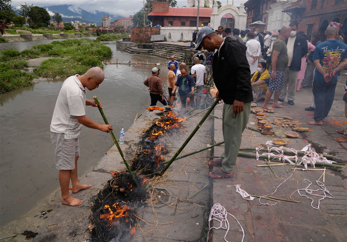 Symbolic funerals held in Nepal for those feared lost as some missing tourists make contact