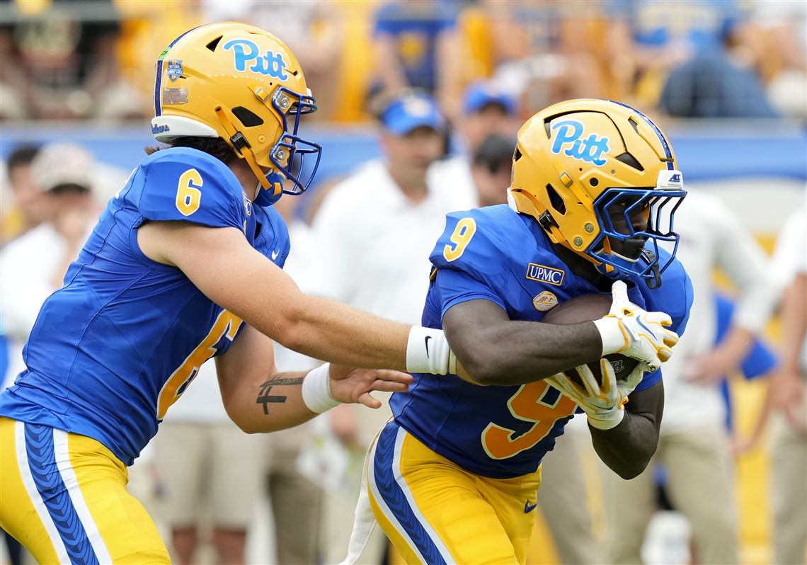 Pitt quarterback Mason Heintschel hands off to running back Ja’Kyrian Turner during the first half of a college football game against Miami (OH) at Acrisure Stadium on Saturday, Sept. 5, 2026.