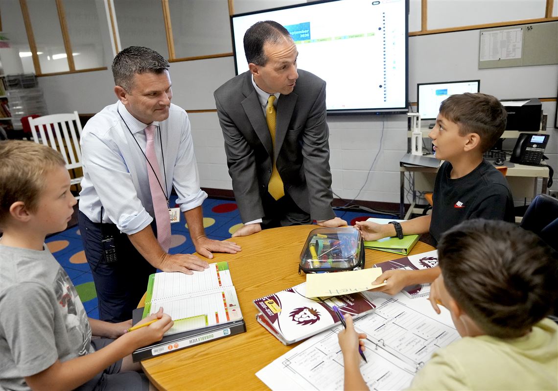 Two small school districts. One very busy boss.