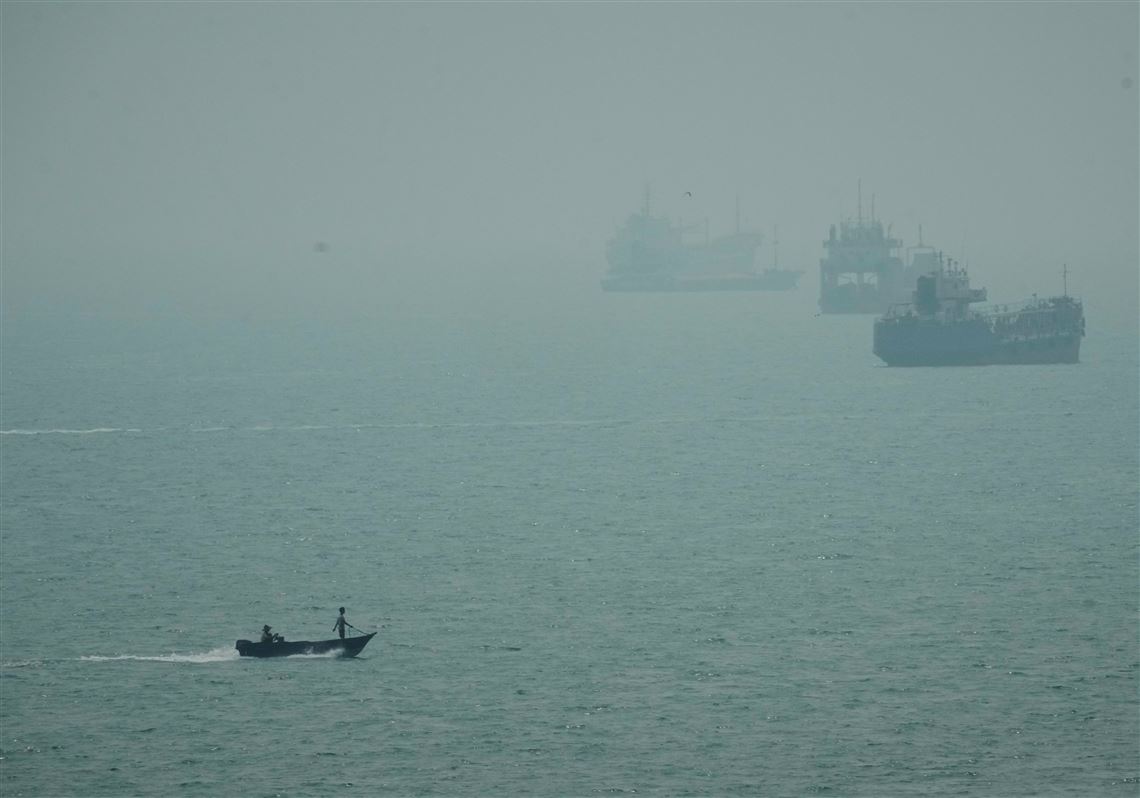 Iranian cargo ship is struck, and talks between Tehran and its neighbors are postponed