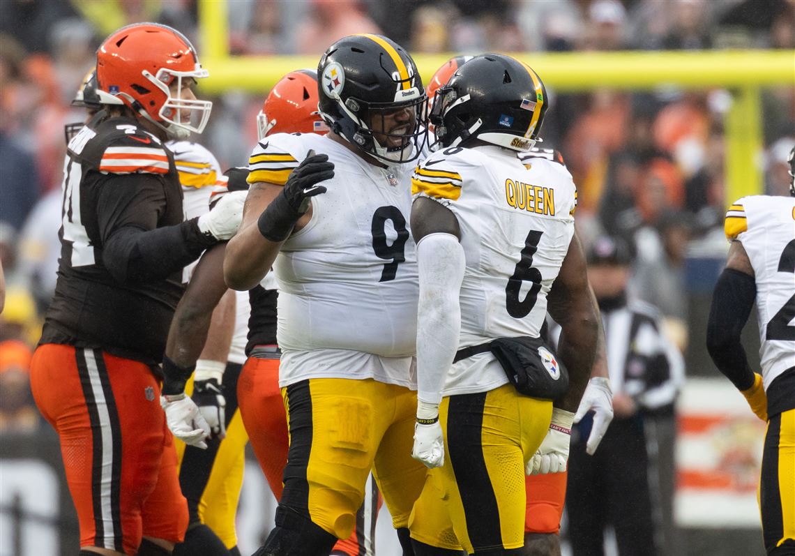 Steelers and Browns players competing during a divisional game.