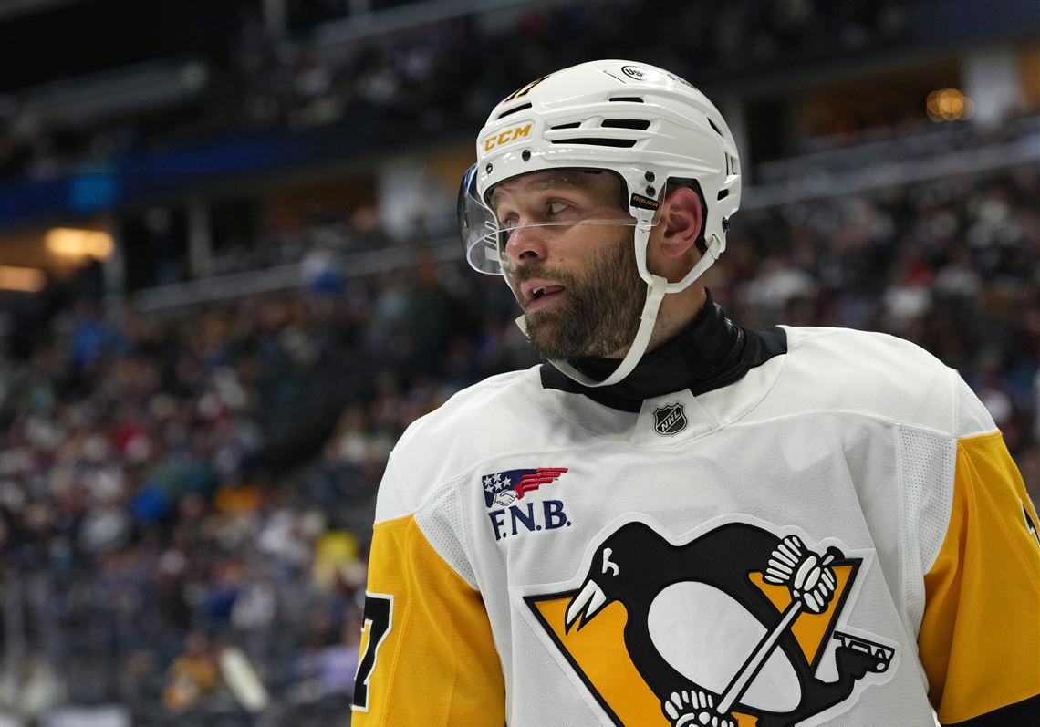 Pittsburgh Penguins right winger Bryan Rust in an NHL game photo used with the injury update.
